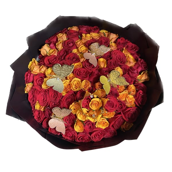 Bouquet of red and yellow roses with butterfly decorations