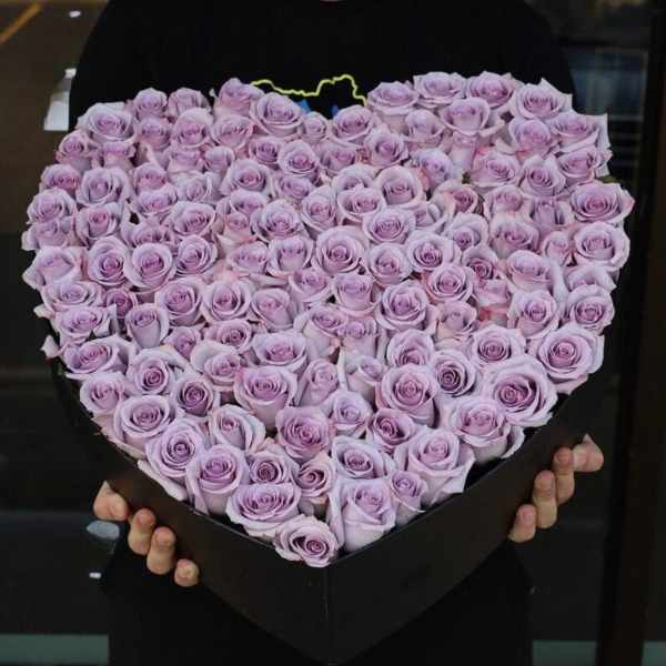 Heart-shaped box filled with lavender roses