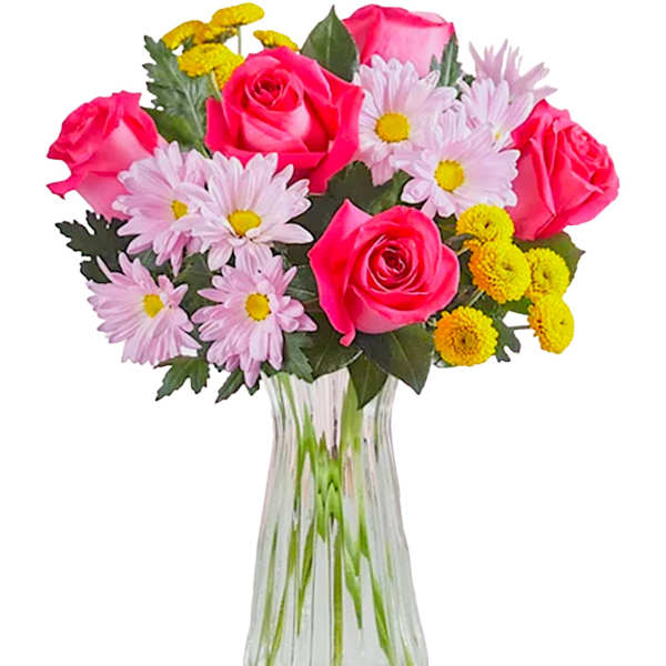 Bouquet of pink roses and daisy-like flowers in a clear glass vase