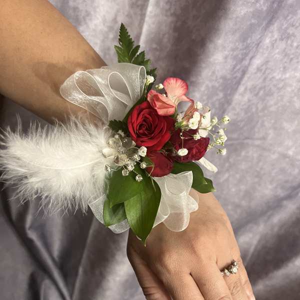 Red in feather corsage