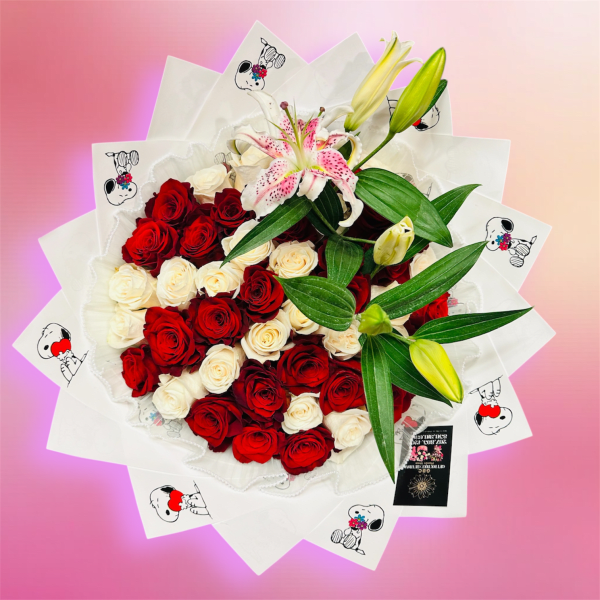 Bouquet of red and white roses with a pink lily