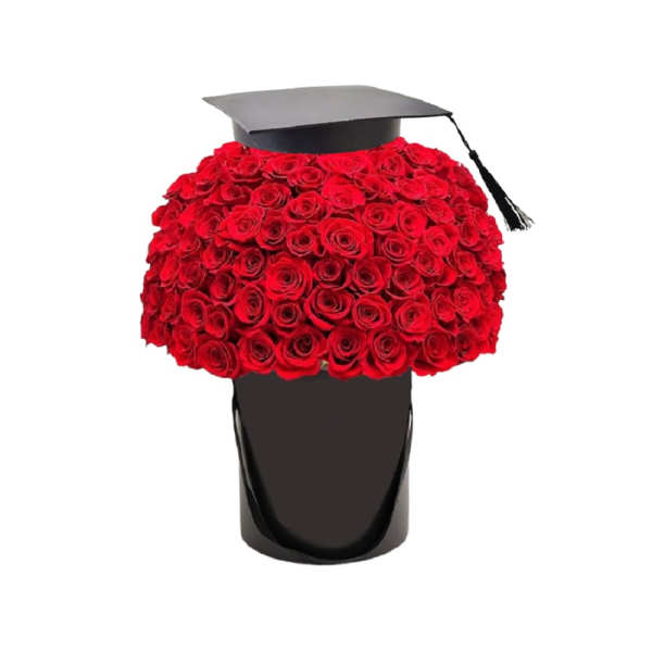 Red rose arrangement in a black hatbox with a graduation cap topper