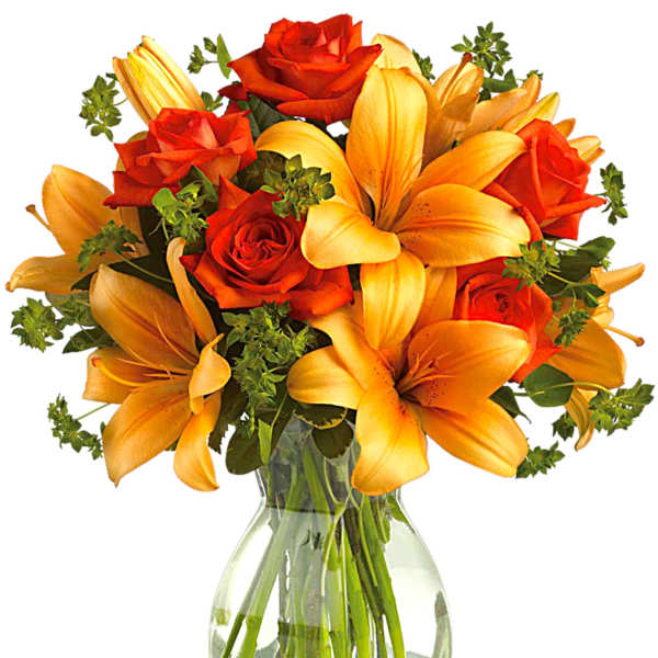 Orange lilies and red roses in a clear glass vase