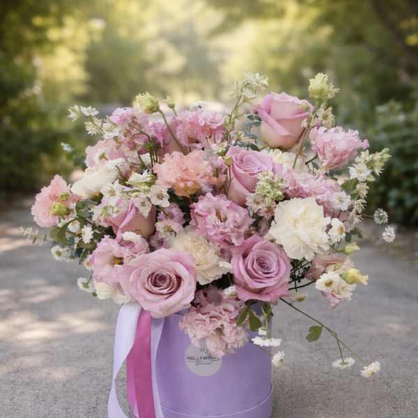Pink and white rose bouquet in a lavender hat box with ribbon