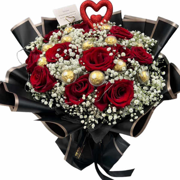 Bouquet of red roses with white baby's breath and gold chocolates