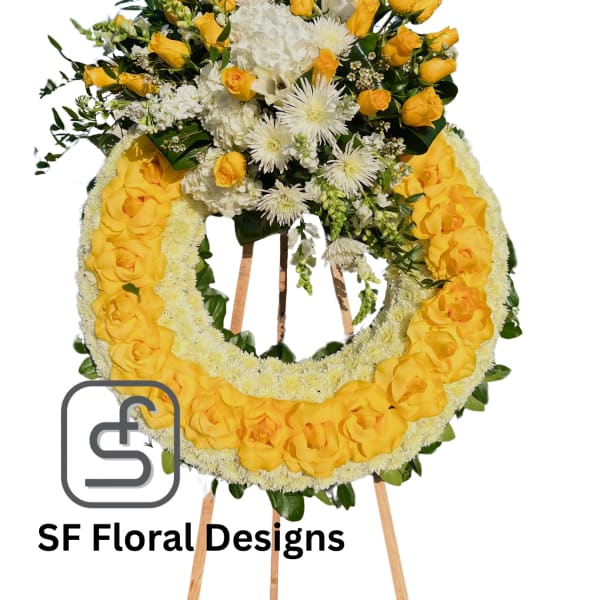 Standing yellow and white rose and mum wreath on a wooden easel