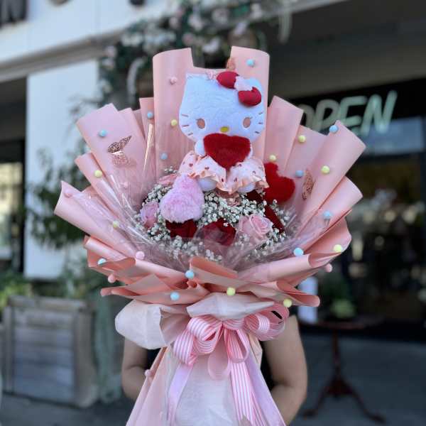 Pink bouquet with a Hello Kitty plush toy and roses