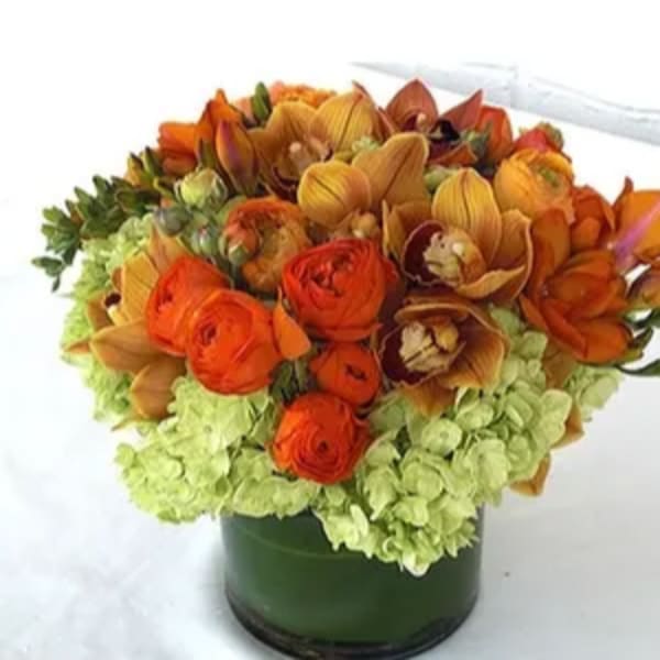 Orange and yellow bouquet in a dark vase