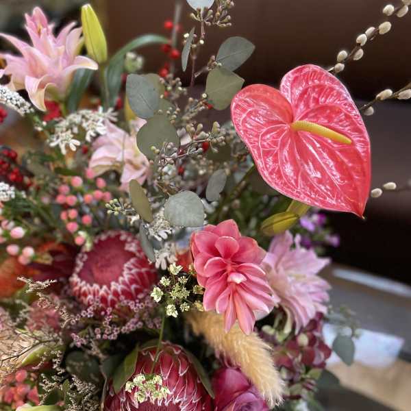 Pink and red mixed bouquet with lilies, protea, and anthurium