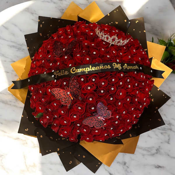 Round bouquet of red roses with a black and gold wrap