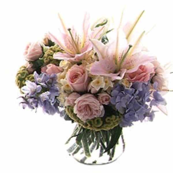 Pink and lavender bouquet in a clear glass vase