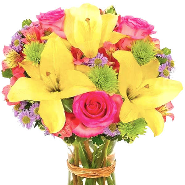 Bright mixed bouquet with yellow lilies and pink roses in a glass vase