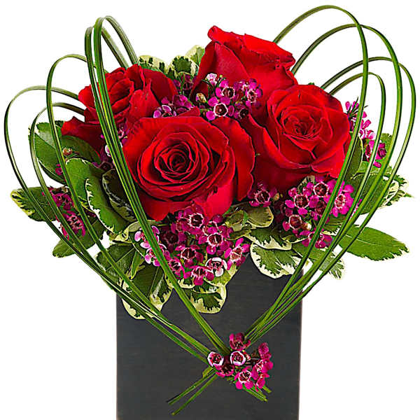 Red roses and pink filler flowers in a black square vase