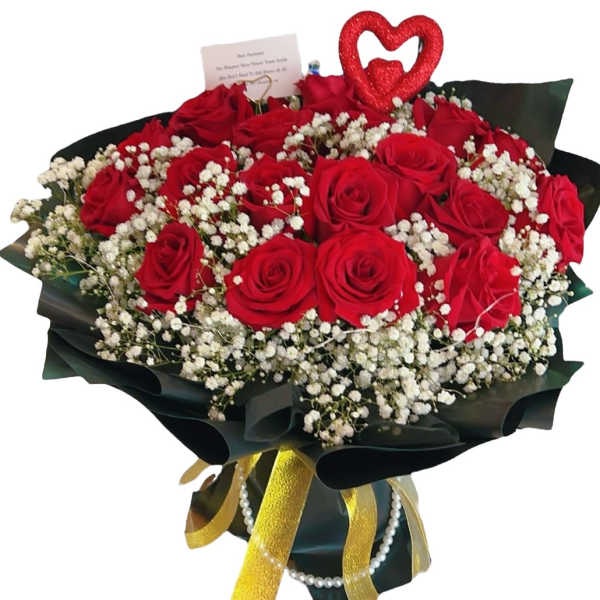 Bouquet of red roses with white baby's breath and a heart topper