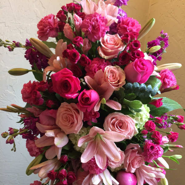 Large bouquet of pink roses, lilies, and carnations