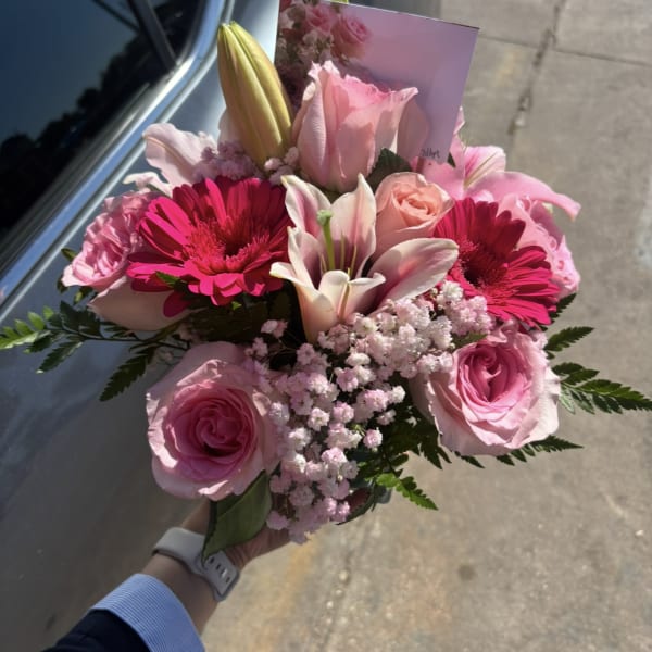 Pink bouquet with roses, lilies, and bright gerbera daisies