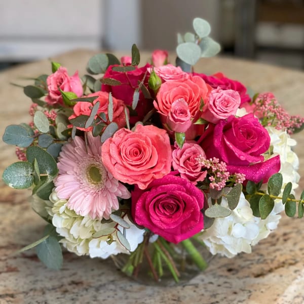 Pink and white rose bouquet with eucalyptus and a gerbera daisy