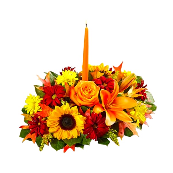 Autumn floral centerpiece with a tall orange candle