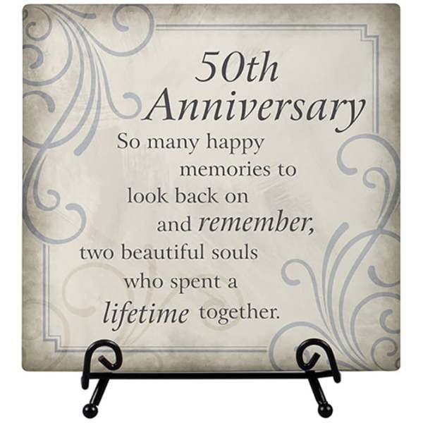 Decorative plaque reading "50th Anniversary" on a stand
