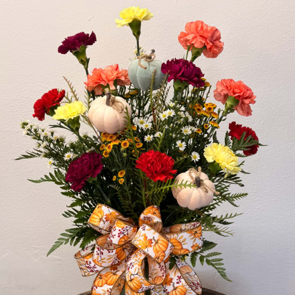 Fall bouquet with carnations, small daisies, pumpkins, and a pumpkin ribbon