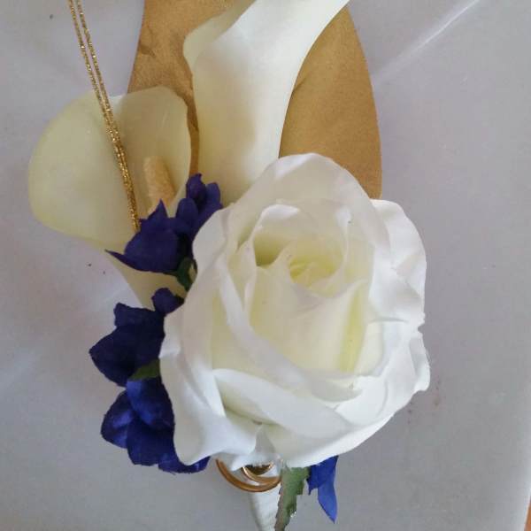 White rose with purple accents and gold decorative leaves