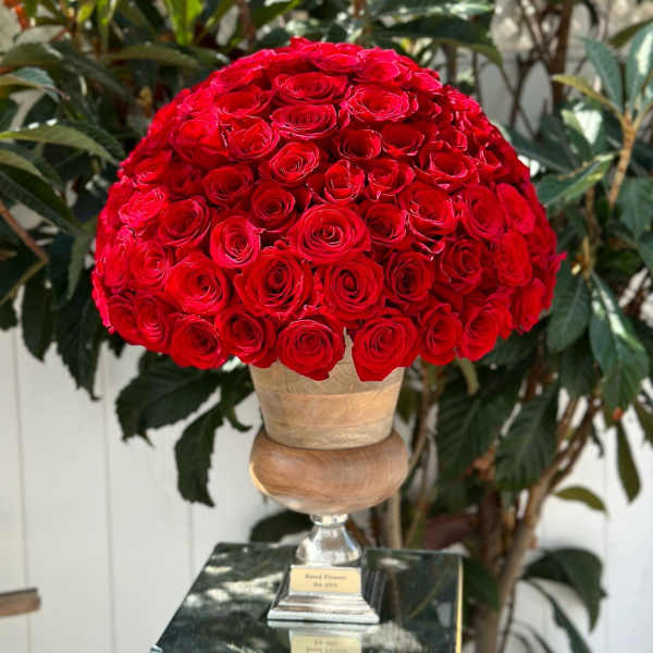 Large dome of red roses in a pedestal vase