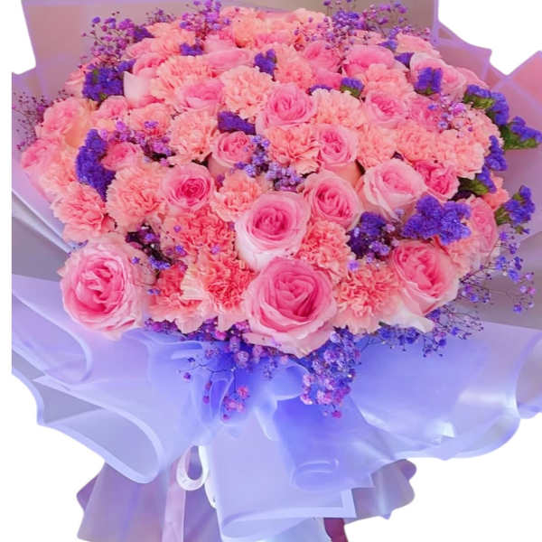 Large bouquet of pink roses and carnations with purple filler flowers