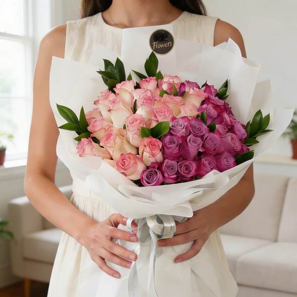 luxurious Purple & Pink Roses wrapped Bouquet