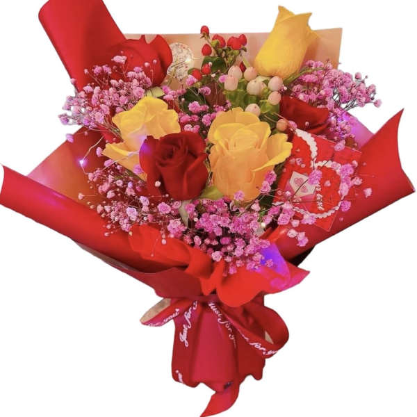 Bouquet of red and yellow roses with pink filler flowers