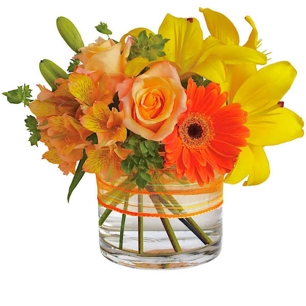 Orange and yellow mixed bouquet in a clear glass vase