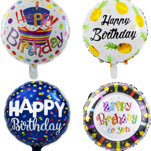 Four birthday foil balloons with colorful printed designs