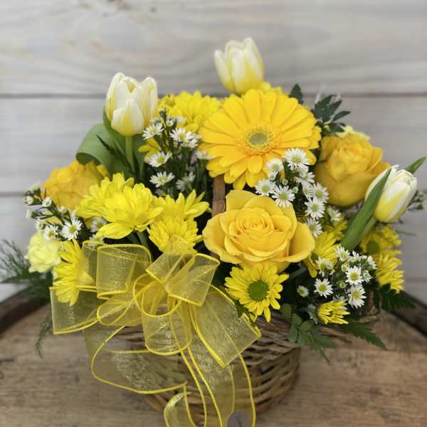 Yellow flower basket with roses, daisies, and tulips