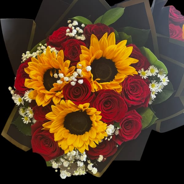 Bouquet of red roses and yellow sunflowers with white filler flowers