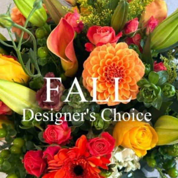 Mixed bouquet with roses, calla lilies, and a dahlia in bright fall colors