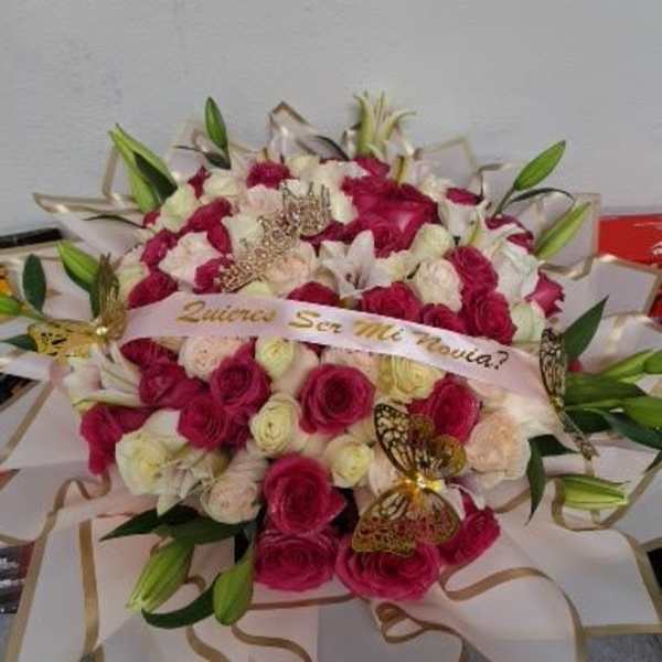 Bouquet of pink and white roses with lilies and ribbon