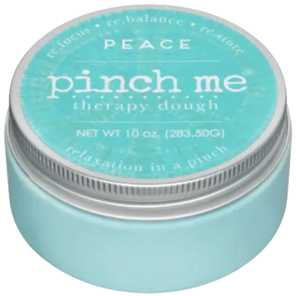 A turquoise jar labeled "pinch me therapy dough" with a silver lid