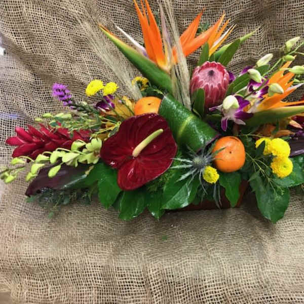 Tropical floral arrangement with red anthurium and orange bird-of-paradise blooms
