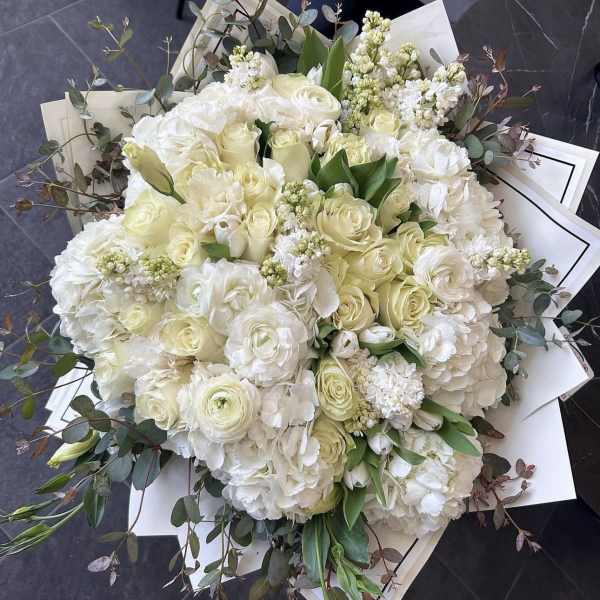 Large bouquet of white roses and hydrangeas with eucalyptus