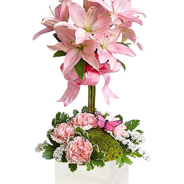 Pink lilies and carnations in a white wooden box with a butterfly accent