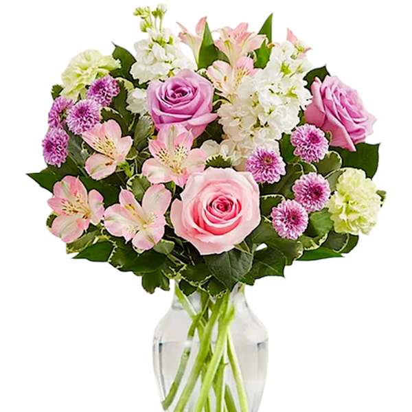 Pink and white mixed bouquet in a clear glass vase