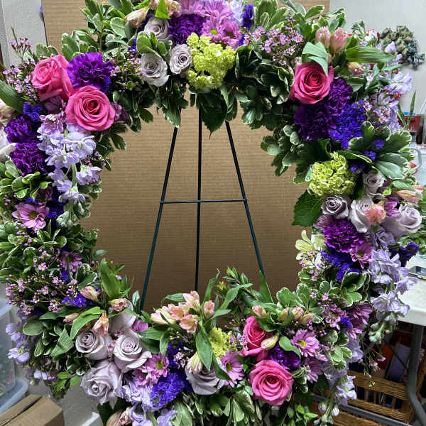 Large floral wreath with pink, purple, and lavender flowers