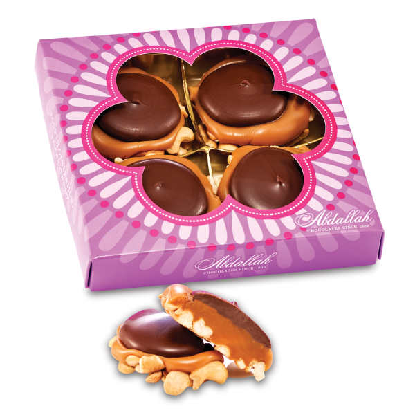 Box of chocolate-covered treats with one piece shown outside the package