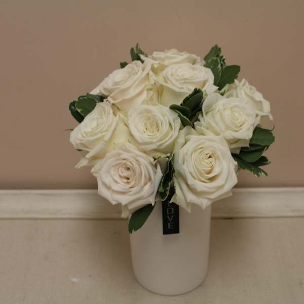 White rose bouquet in a white vase