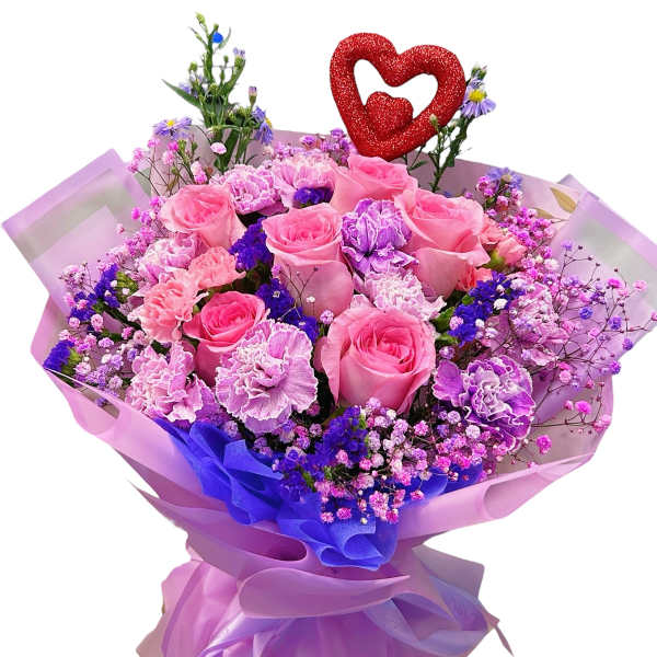 Pink rose bouquet with purple filler and a red heart topper
