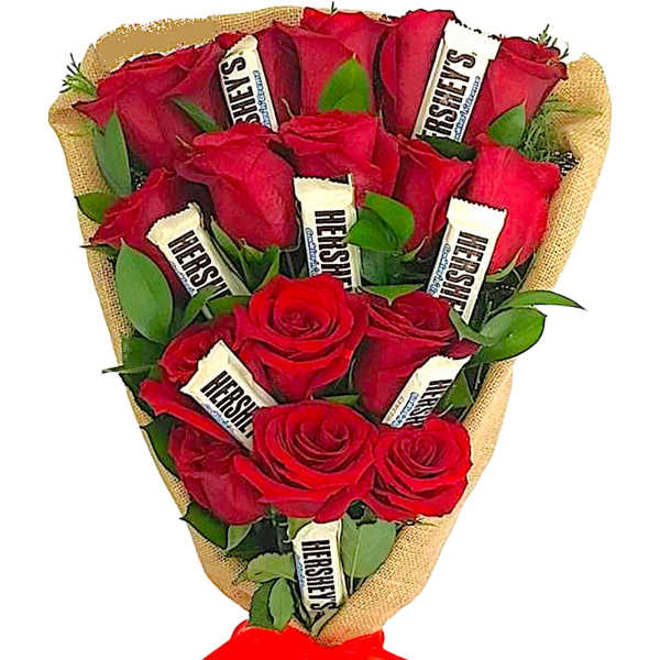 Bouquet of red roses wrapped in burlap with a red ribbon