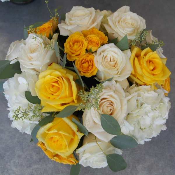 Bouquet of white and yellow roses with white hydrangeas