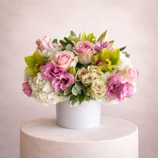 Pink and white mixed bouquet in a white vase