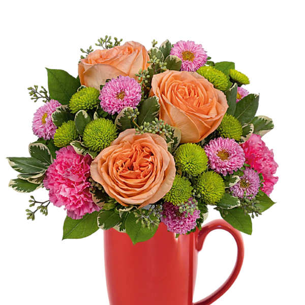 Peach roses and pink flowers arranged in a red mug
