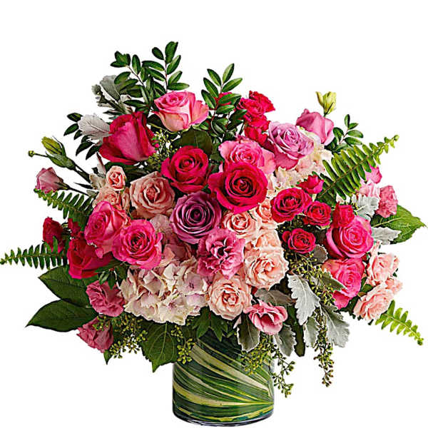 Bouquet of pink and peach roses in a green-striped glass vase