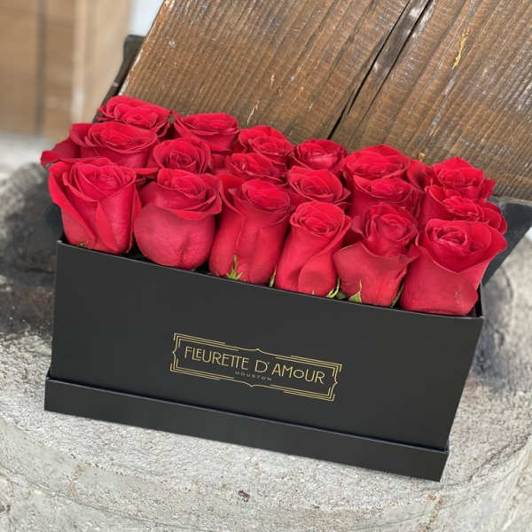 Box of red roses in a black gift box